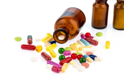 © Ginasanders | Dreamstime.com - <a href="https://www.dreamstime.com/stock-photo-many-tablets-container-glas-photo-icon-addiction-costs-medicine-medicines-image48826983#res2965056">Many Tablets With Container Photo</a>